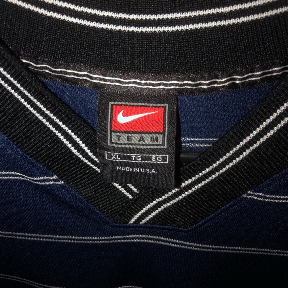 Vintage Nike Blue/White Striped T-Shirt .